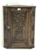 Small early 20th century carved oak corner cupboard, H56cm,