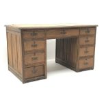 Edwardian oak twin pedestal desk, leather inset top, eight short and one long drawer, W122cm, H69cm,