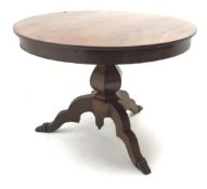 Victorian mahogany circular dining table, hexagonal baluster column, three shaped supports, D110cm,