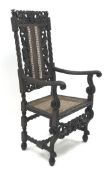 Carolean style oak chair, heavily carved back depicting mermaids, cane work splat and seat,