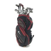 A quantity of golf clubs and irons with a Nike bag Condition Report <a
