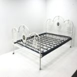 Victorian ornate arched cast iron bedstead, W140cm, H115cm,