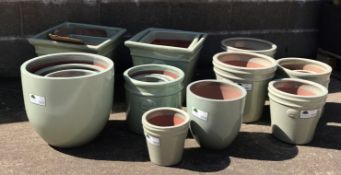 Six graduating square tapering glazed ceramic planters, five egg pots,