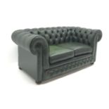 Two seat Chesterfield sofa, upholstered in deep buttoned green leather, bun feet,