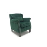 Low backed armchair upholstered in studded emerald velvet, square tapering supports,