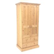Solid Pine wardrobe, projecting cornice, two doors enclosing fitted interior above two drawers,