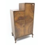 Early 20th century Art Deco style walnut gentleman's stepped wardrobe,