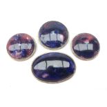 Three Moorcroft Pansy pattern circular brooches and an oval example in silver-plated mounts,