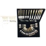 Unused Japanese Dinner Mate 32-piece canteen of stainless steel and gold plated cutlery, boxed,