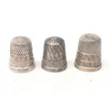 Three 'The Spa' silver thimbles, relief decorated London, Stratford on Avon and Colchester,