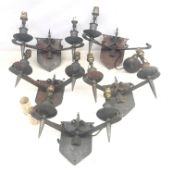 Five Gothic style forged steel twin branch wall lights, re-wired,