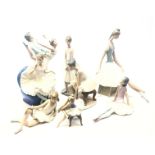 Lladro model of a seated Ballet dancer, another seated on a chair and six Nao Ballet dancers,