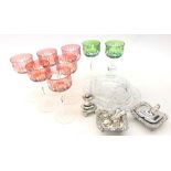 Eight cut glass hock glasses with red and green glass bowls on faceted stems,