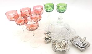 Eight cut glass hock glasses with red and green glass bowls on faceted stems,