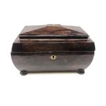 19th century mahogany tea caddy of sarcophagus form on bun feet,