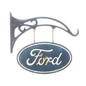 Reproduction Ford oval double sided sign hanging on a metal bracket,