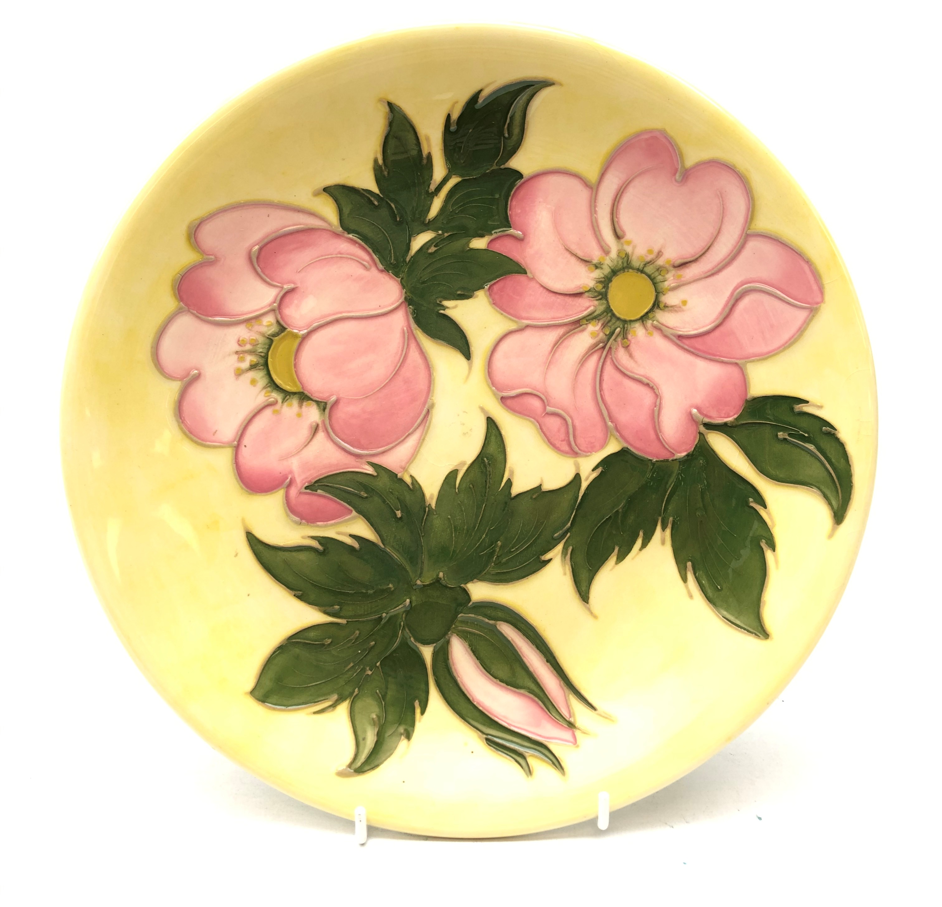 Walter Moorcroft Wild Rose pattern circular plate on yellow ground,