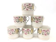 Set of six early 19th century English porcelain coffee cans decorated with pink and yellow flowers