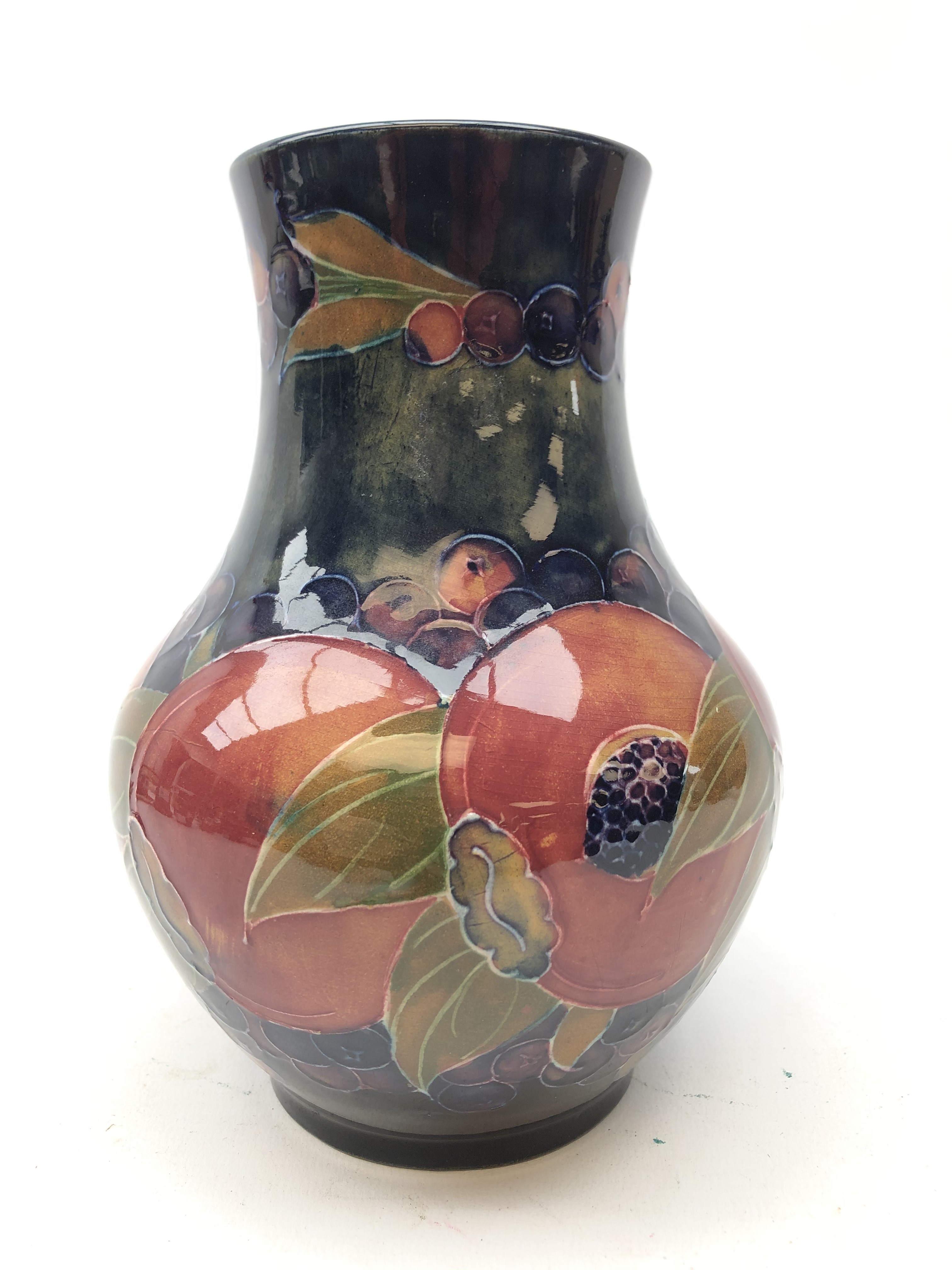 William Moorcroft Pomegranate pattern vase of baluster form with cylindrical neck,