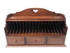 Mahogany stationary cabinet, pierced arched top,