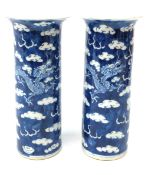 Pair of late 19th/early 20th century Chinese cylindrical vases each decorated with dragons chasing