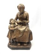 Early 20th century French plaster figure of a grandmother and child, incised Paris 723,