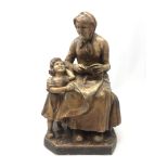 Early 20th century French plaster figure of a grandmother and child, incised Paris 723,