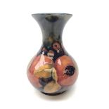 William Moorcroft Pomegranate pattern baluster vase with flared rim, c1920 H13.