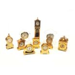 Waterford and Edinburgh crystal miniature mantle clocks and eight other miniature brass clocks (10)