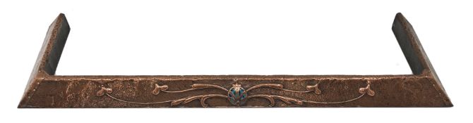 Art Nouveau period beaten and embossed copper fire fender with central Ruskin style cabochon