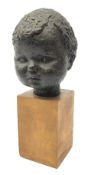 20th century bronze head of a child on wooden base, indistinctly signed in pencil,