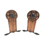 Pair Art Nouveau period beaten and embossed copper fire dogs,