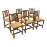 Set six (5+1) 'Mouseman' lattice carved back dining chairs with studded leather seats on octagonal