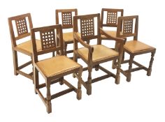 Set six (5+1) 'Mouseman' lattice carved back dining chairs with studded leather seats on octagonal