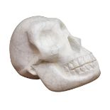 Darren Yeadon (British 1970-): Skull, Carrara Venatino Marble sculpture,