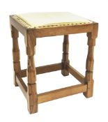 'Mouseman' oak stool with leather top,