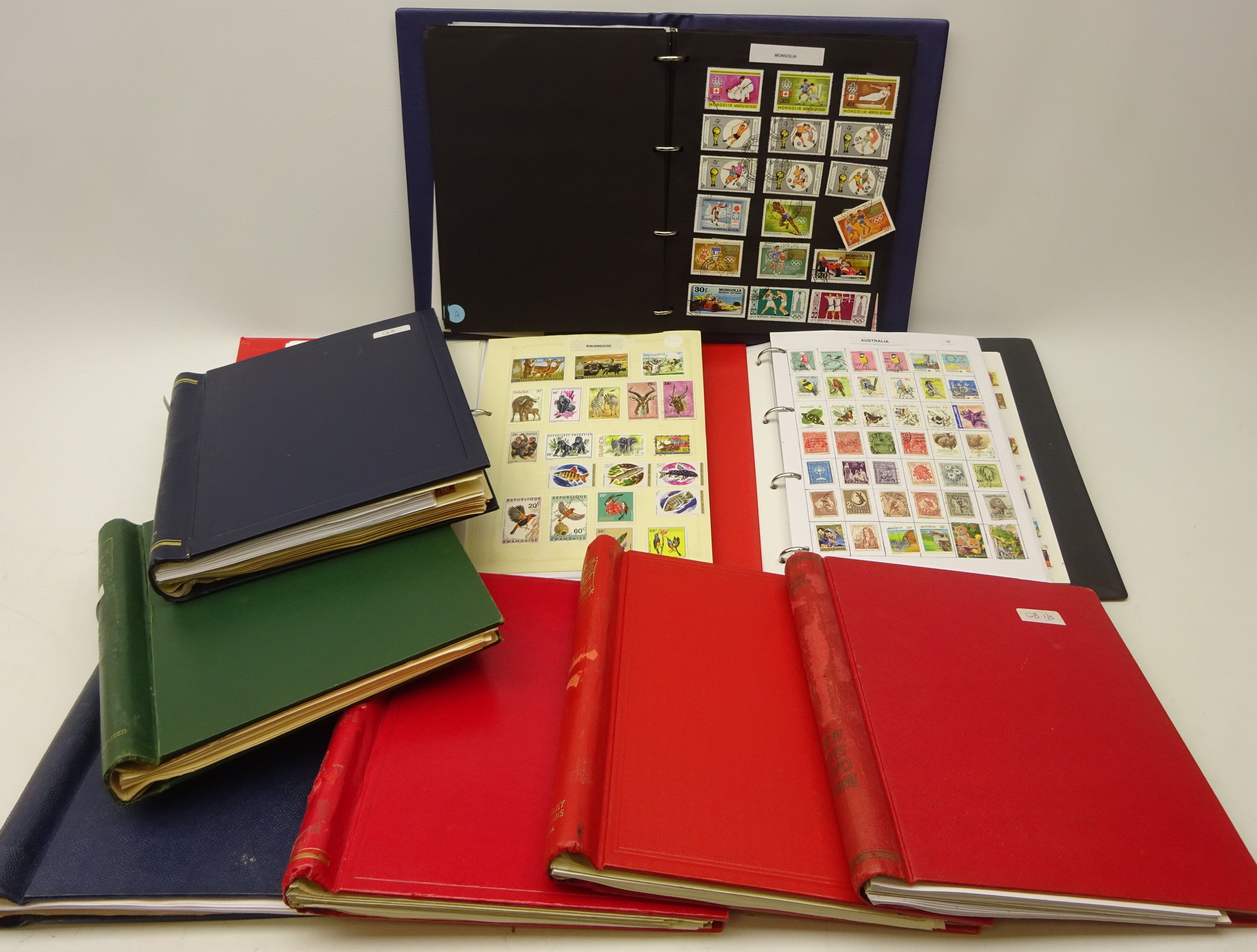 Collection of World stamps in nine albums/folders including Great Britain pre and post