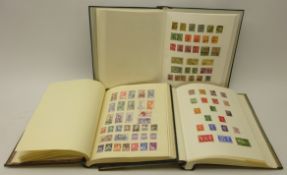 Three stamp albums containing Great British and World stamps including Antigua, Ascension,