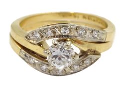 Two gold rings, one set with a round brilliant cut diamond and diamond shoulders,