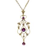 Edwardian pink tourmaline and split seed pearl pendant, stamped 9ct, on gold chain necklace,