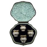 Four Victorian silver salt's, embossed decoration with cartouche by Charles Stuart Harris,