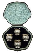 Four Victorian silver salt's, embossed decoration with cartouche by Charles Stuart Harris,