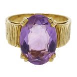 Gold oval single stone amethyst ring, bark effect shank,