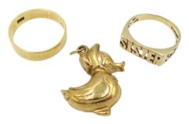 Gold wedding band, stamped 18ct, gold duck charm and a gold 'sister' ring,