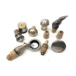 Assorted bottle stoppers comprising a German silver ewer form spirit pourer with hinged cover,