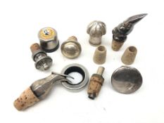 Assorted bottle stoppers comprising a German silver ewer form spirit pourer with hinged cover,