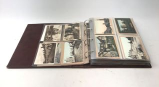 Modern loose leaf album containing over two hundred and seventy Edwardian and later postcards of