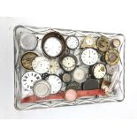 Tray of Assorted pocket watch movements, mostly with white enamel dials,