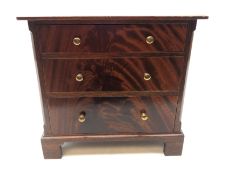 Miniature flame mahogany chest of drawers, three long graduated drawers, bracket feet H29.