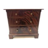 Miniature flame mahogany chest of drawers, three long graduated drawers, bracket feet H29.